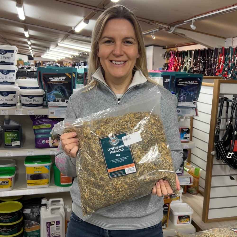 Kathryn Jaquet holding a pack of Equus Health Clivers & Marigold