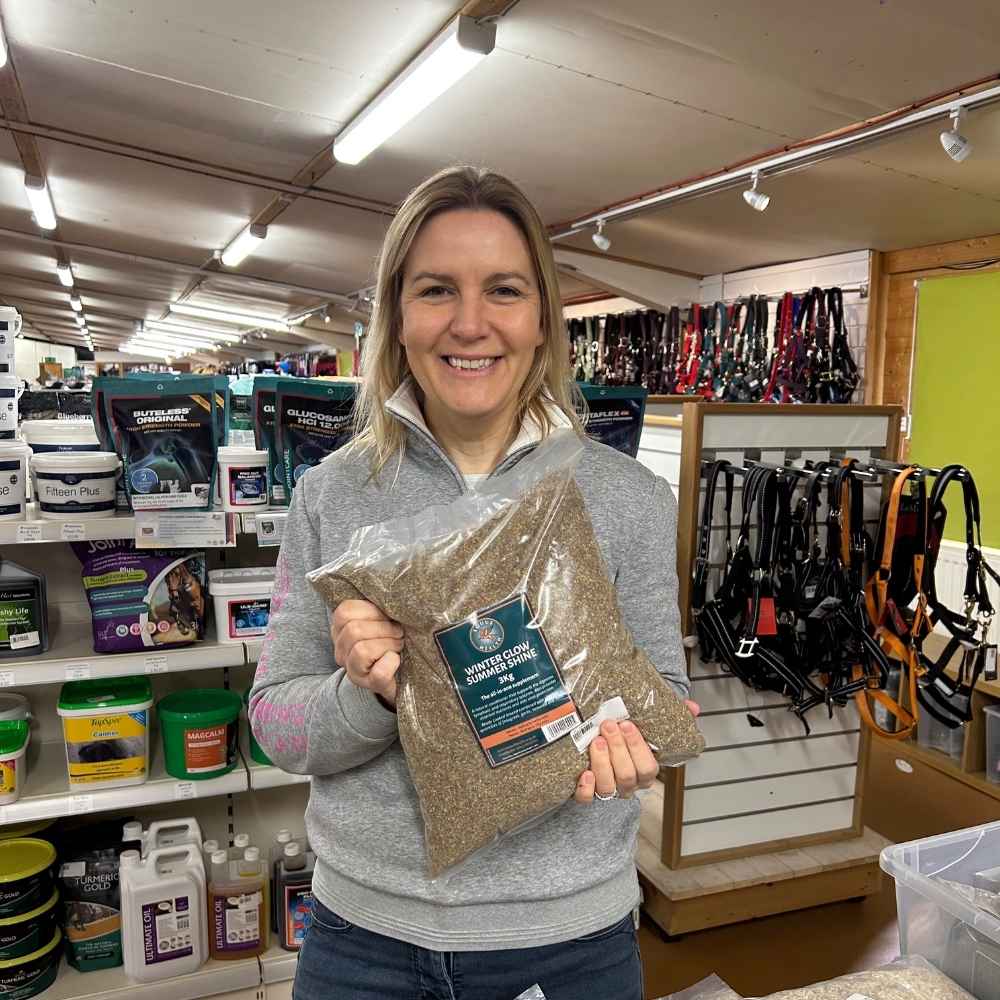 Kathryn Jaquet holds a pack of Equus Health Winter Glow Summer Shine at RB Equestrian