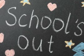 Schools out written over a blackboard