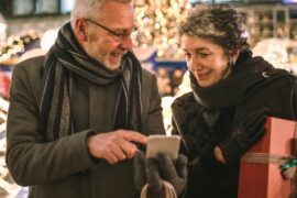 A man and a woman Christmas shopping