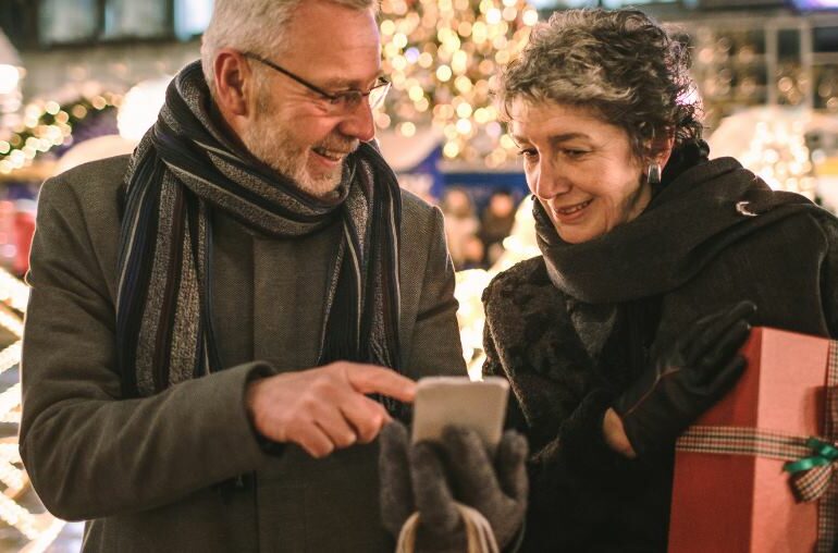 A man and a woman Christmas shopping