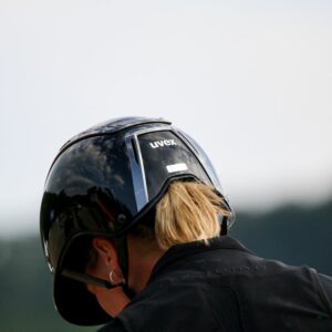 A rider wearing a Uvex riding hat 